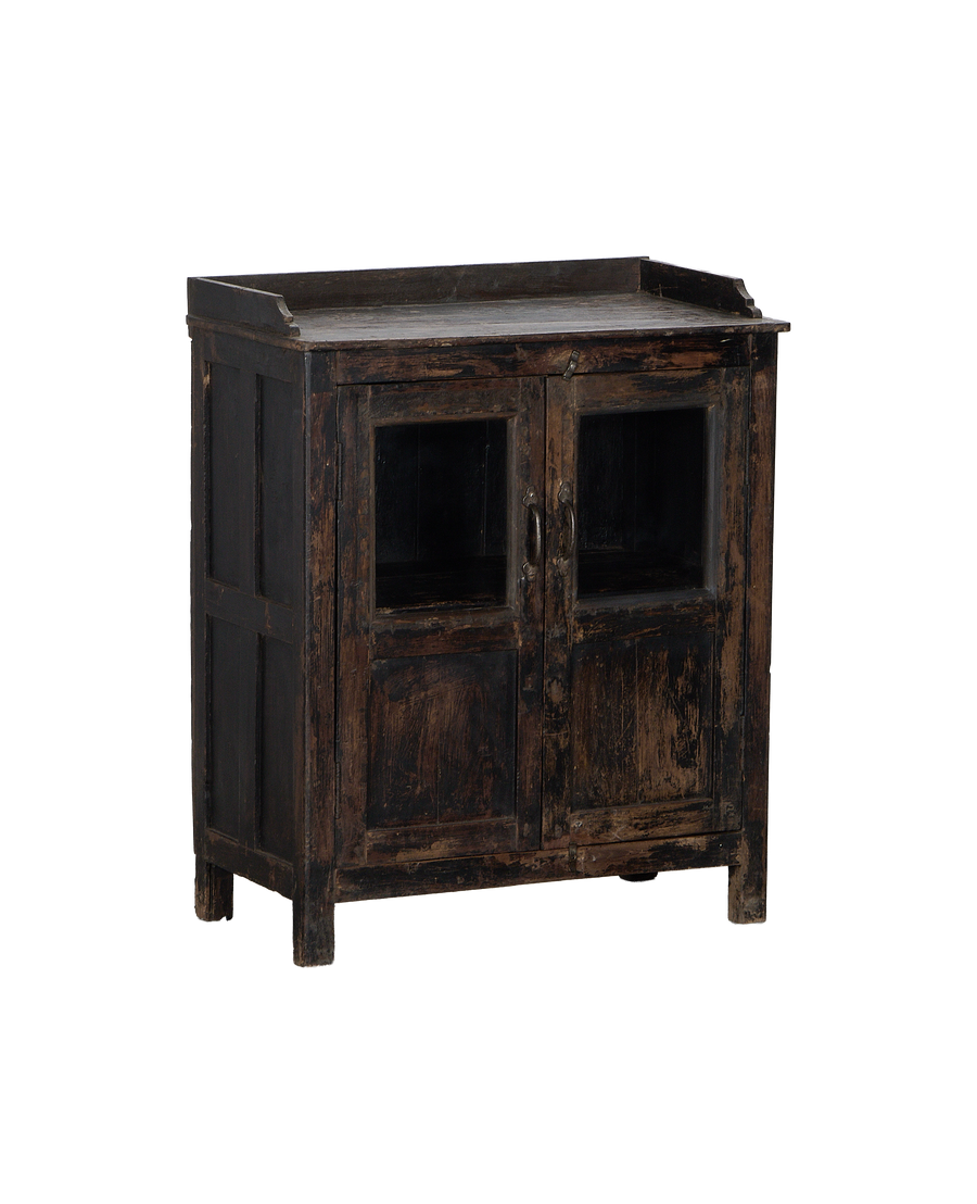 Vintage Indian oak wood cabinet, side view, showcasing distressed texture and glass-pane