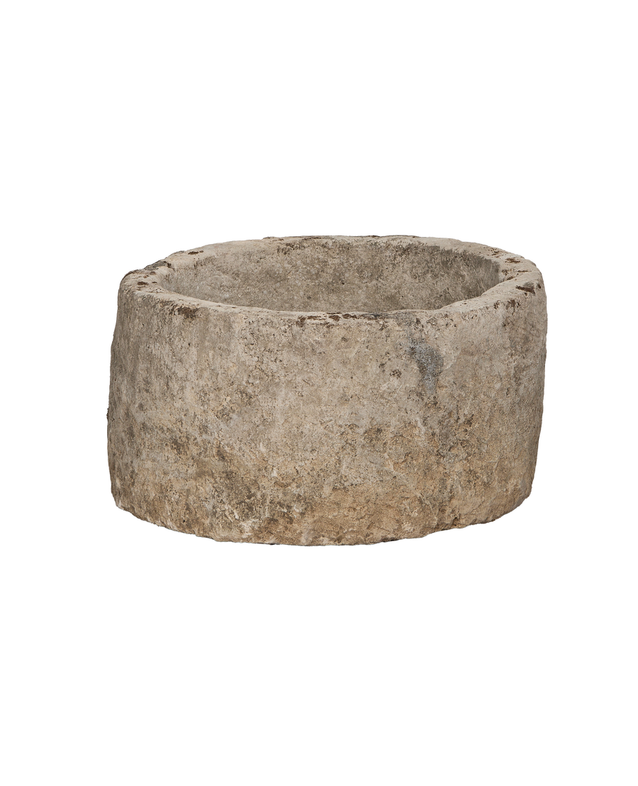 Vintage round limestone trough, showing weathered texture and aged patina from Indonesia