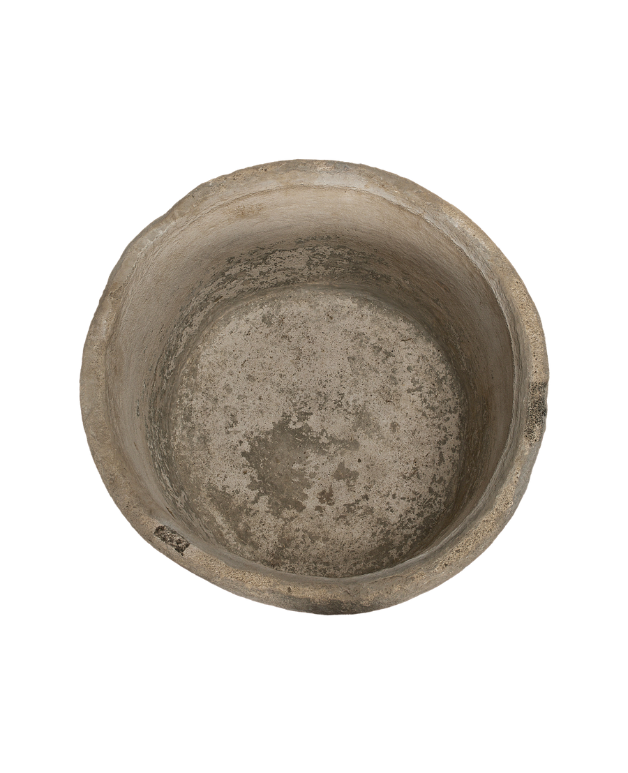 Vintage Indonesian round limestone trough, aged interior showing texture and