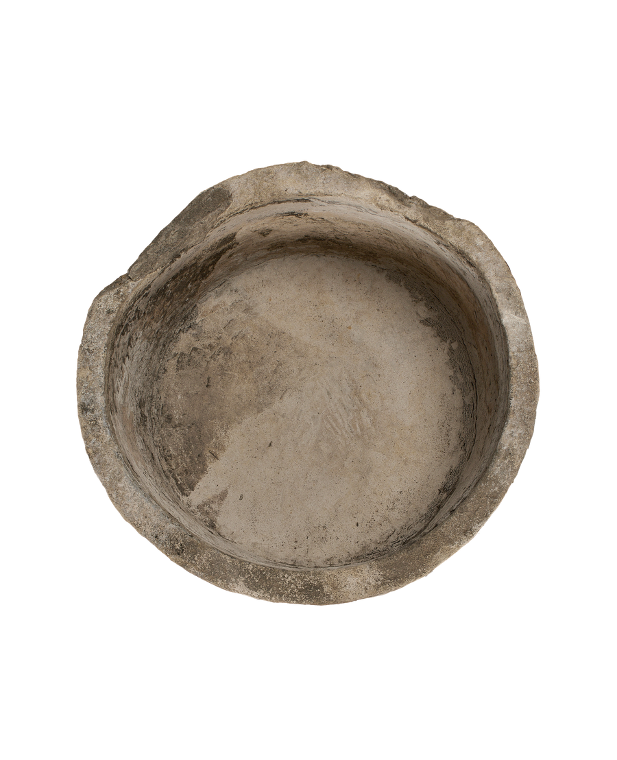 Vintage Indonesian limestone trough, top-down view showing weathered interior texture and condition.