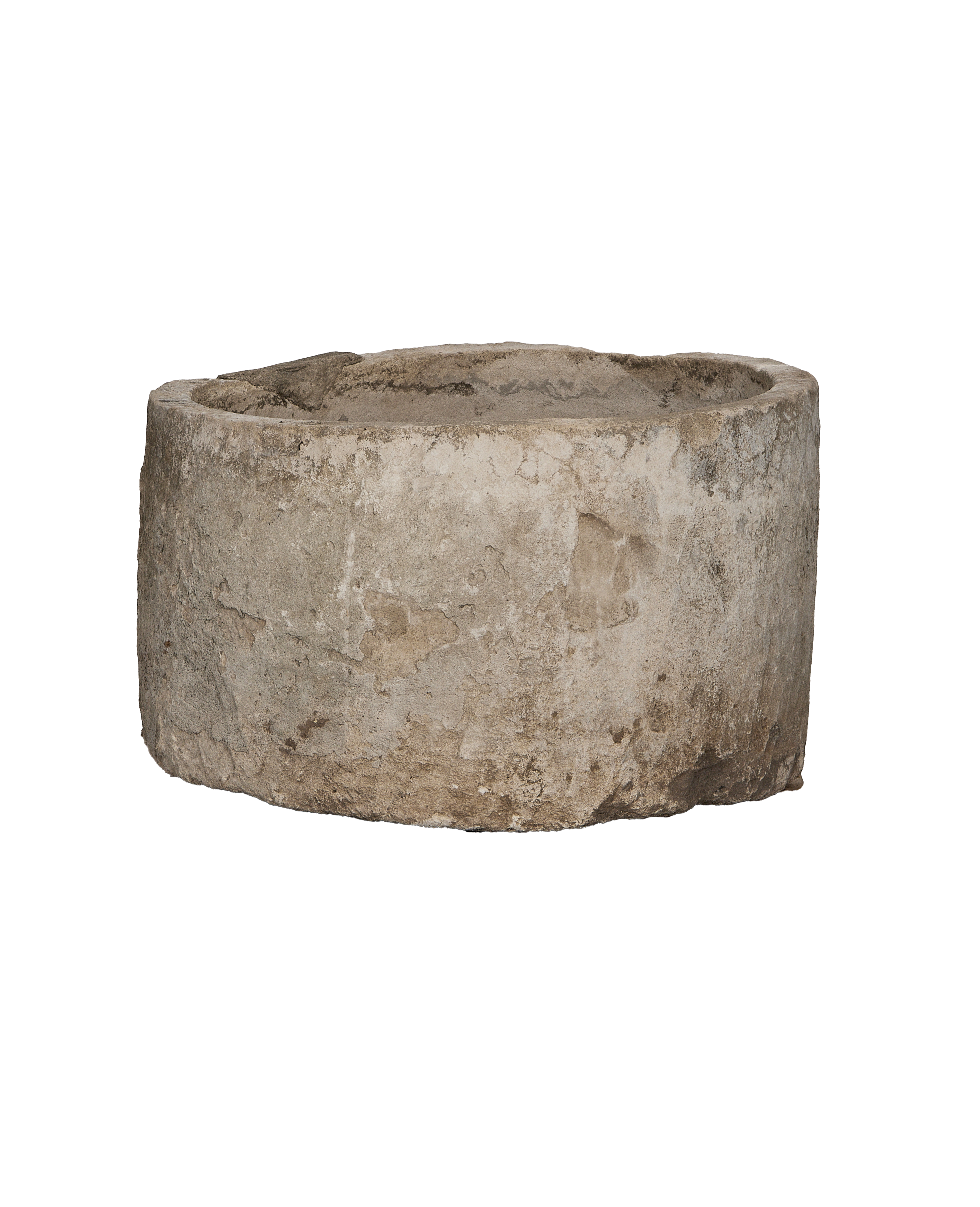 Vintage round limestone trough, close-up of textured exterior showing natural