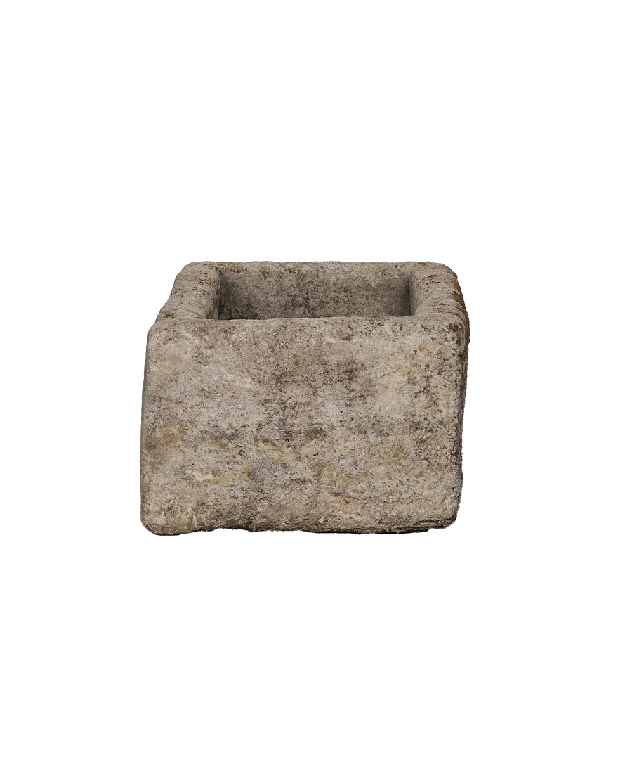 Vintage rectangular limestone trough, front-facing view showcasing rough, aged