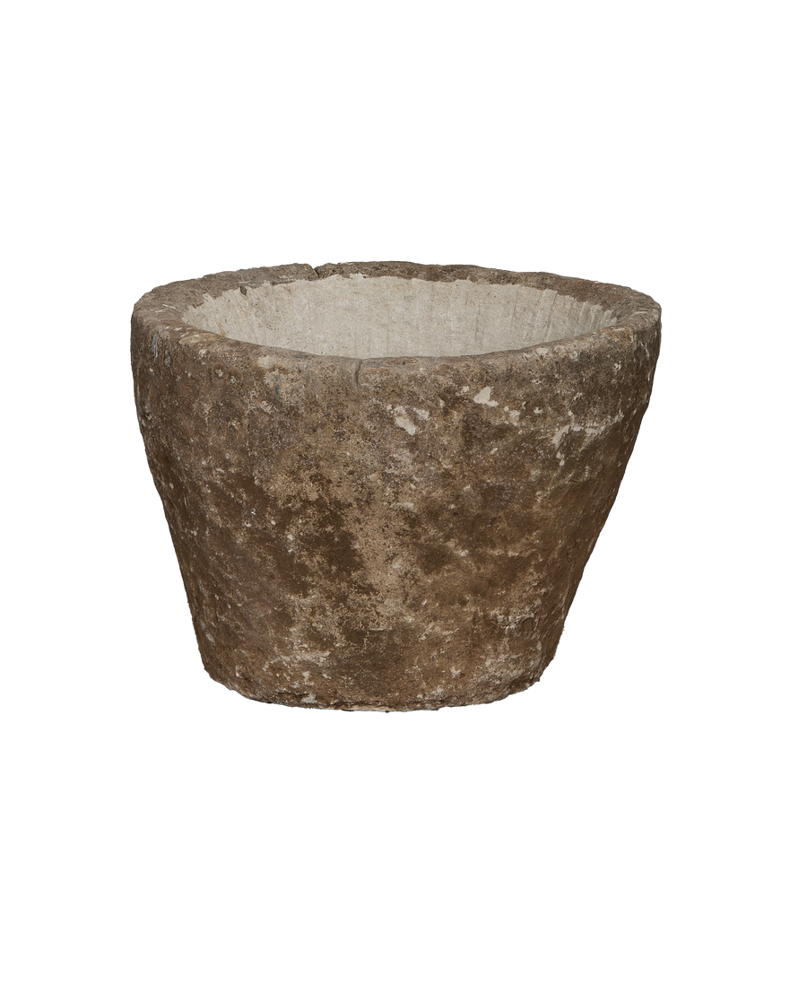 Vintage Indonesian round limestone trough, showing weathered exterior texture and