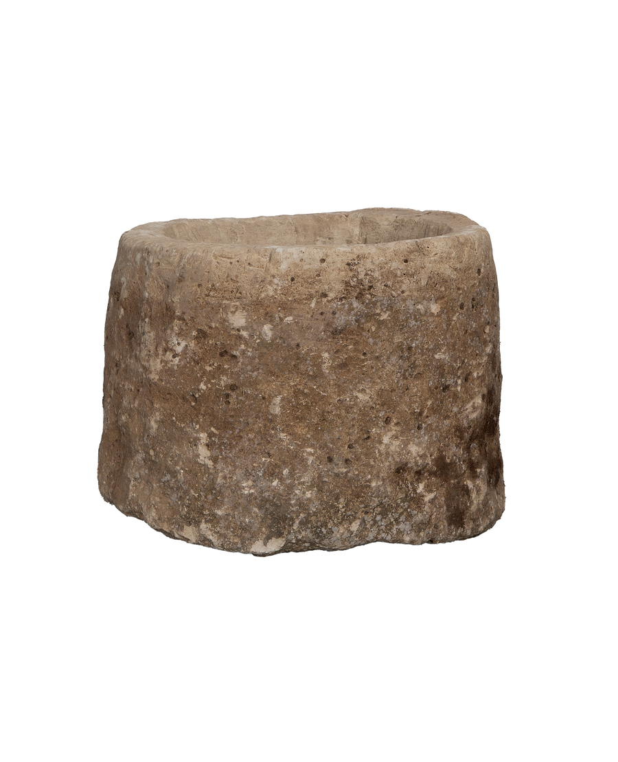 Vintage round Indonesian limestone trough, close-up texture detail showing