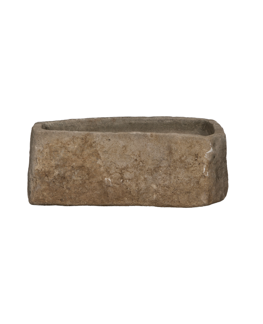 Vintage Indonesian limestone trough, rectangular, showing rough textured side surface and aged condition