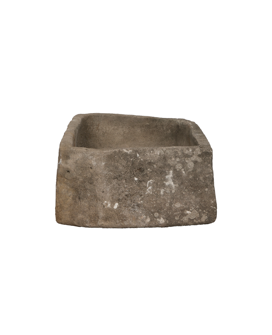 Vintage Indonesian limestone trough showing weathered, rugged