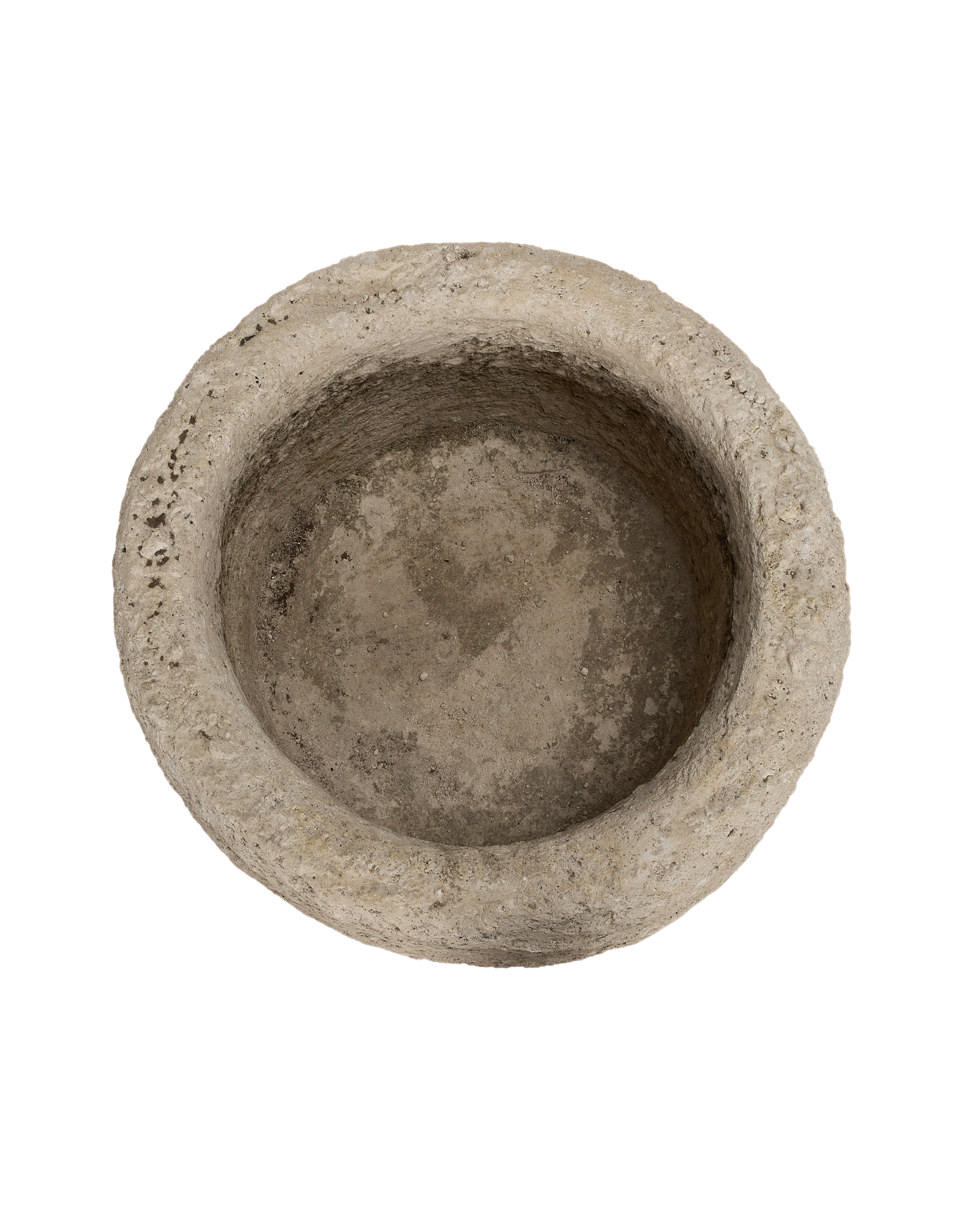 Vintage Indonesian limestone trough, overhead view showcasing weathered round interior texture.