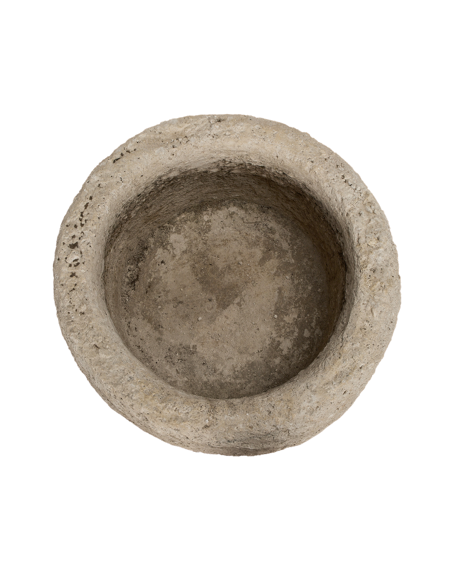 Vintage Indonesian limestone trough, overhead view showcasing weathered round interior texture.