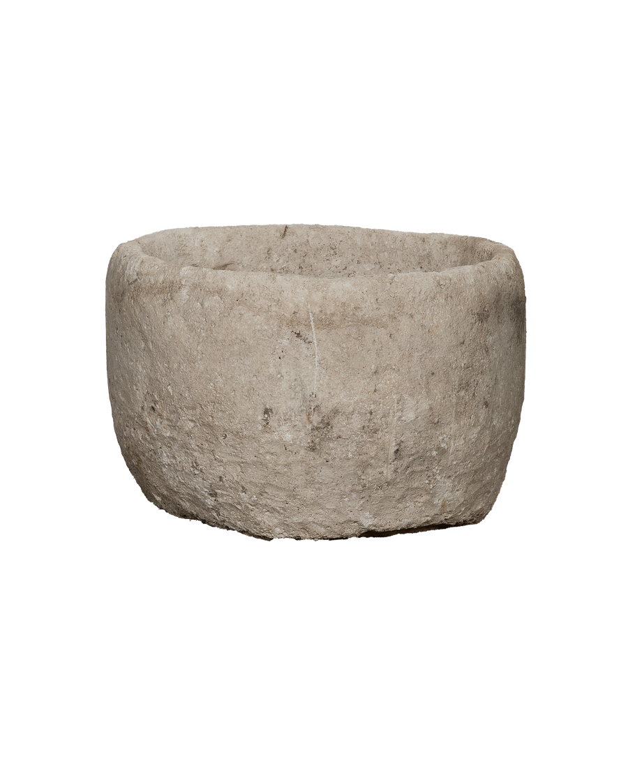 Vintage limestone trough, rough aged texture, rounded rim