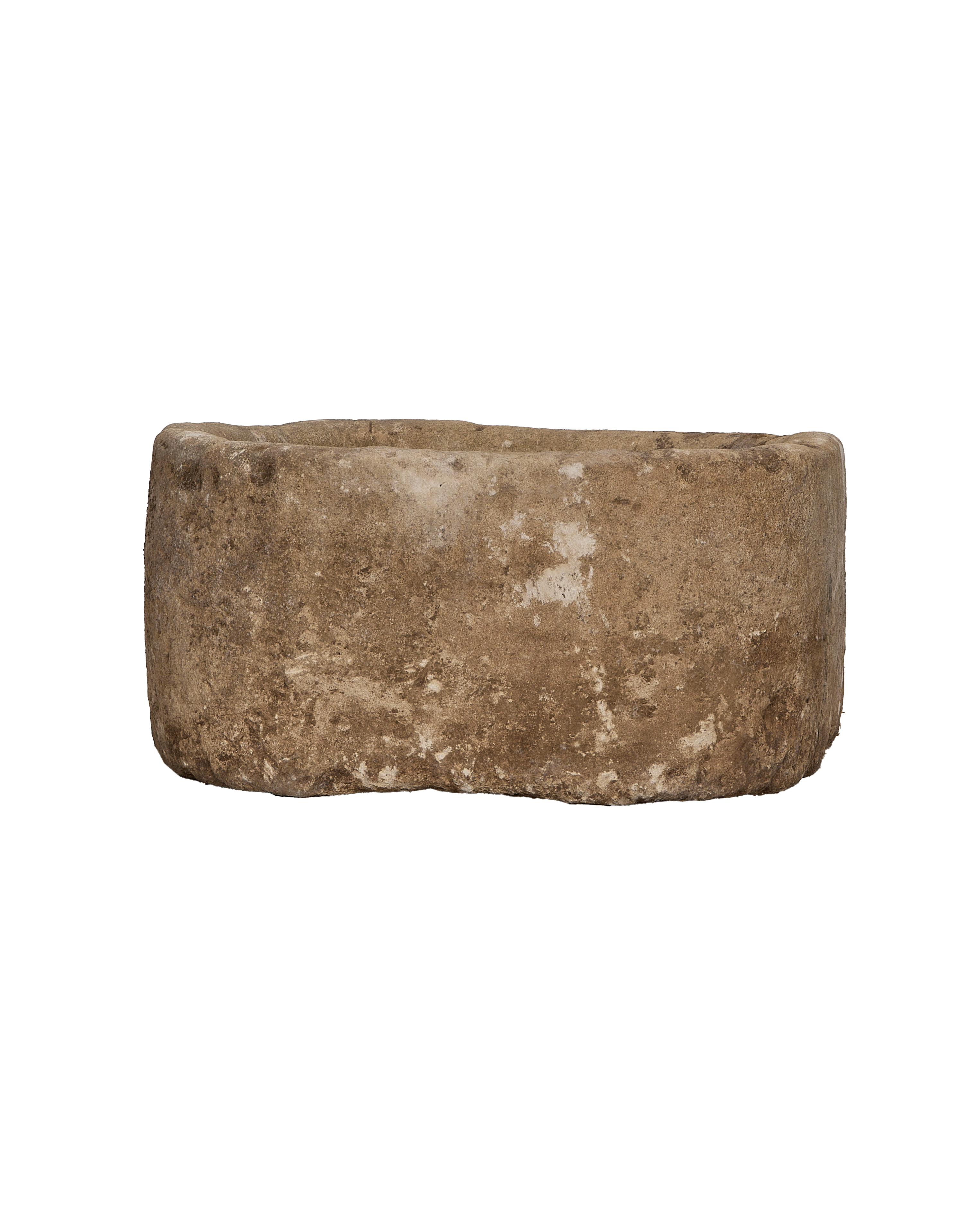 Vintage Indonesian limestone trough, detailed side view highlighting rough texture and weathered