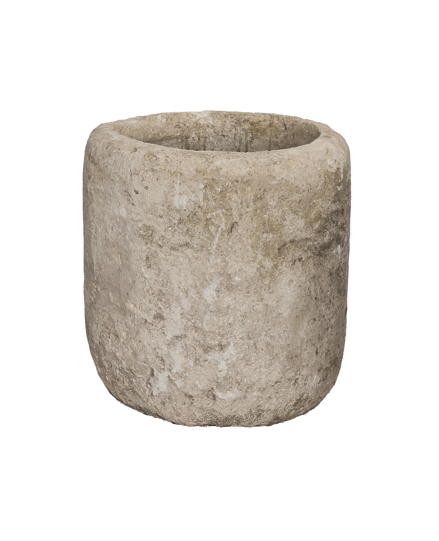 Vintage Indonesian round limestone trough, showing distressed, weathered surface texture and patina.