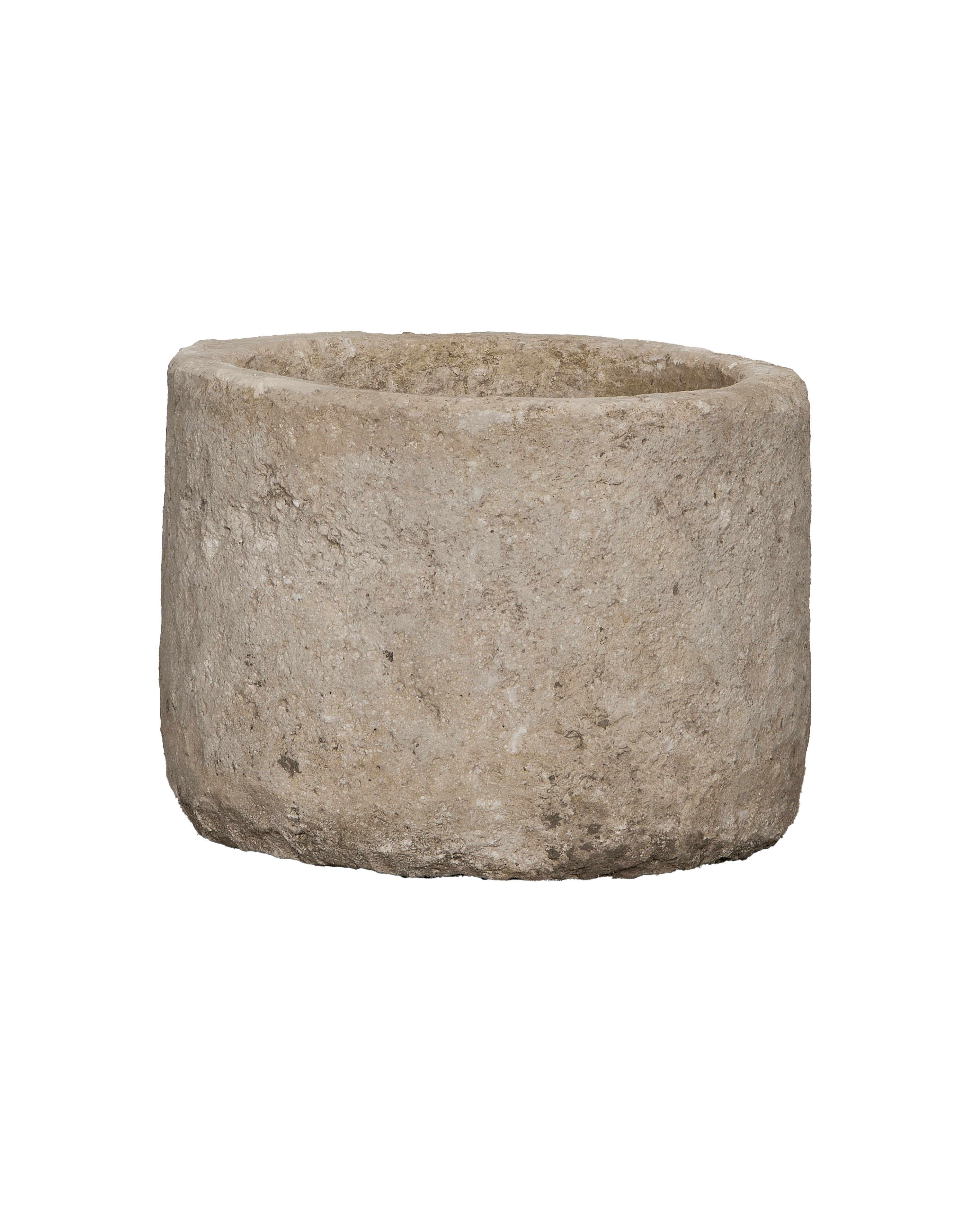 Vintage round limestone trough, close-up showing weathered texture and imperfections.