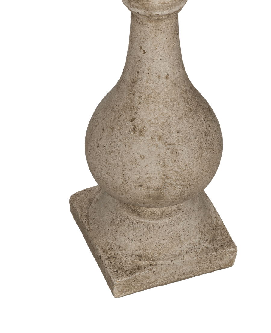 Close-up of the distressed, vintage-style cast stone reproduction cocktail table base detail.
