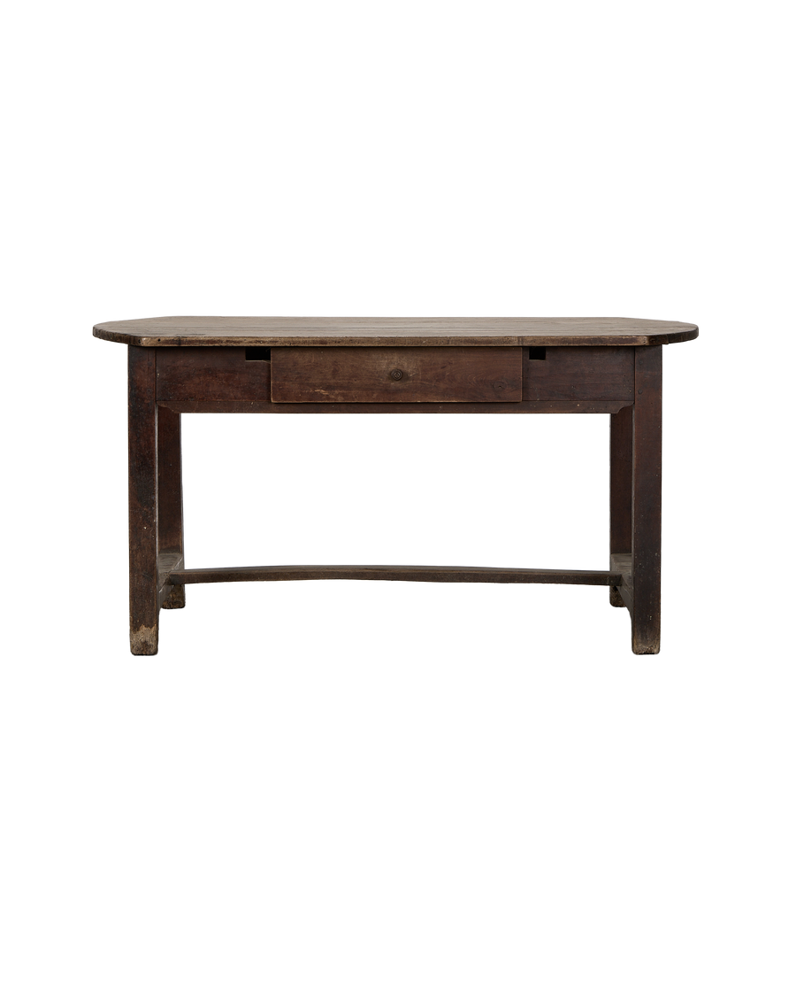 Vintage French oak dining table with curved edges, single drawer, and rustic wood grain.