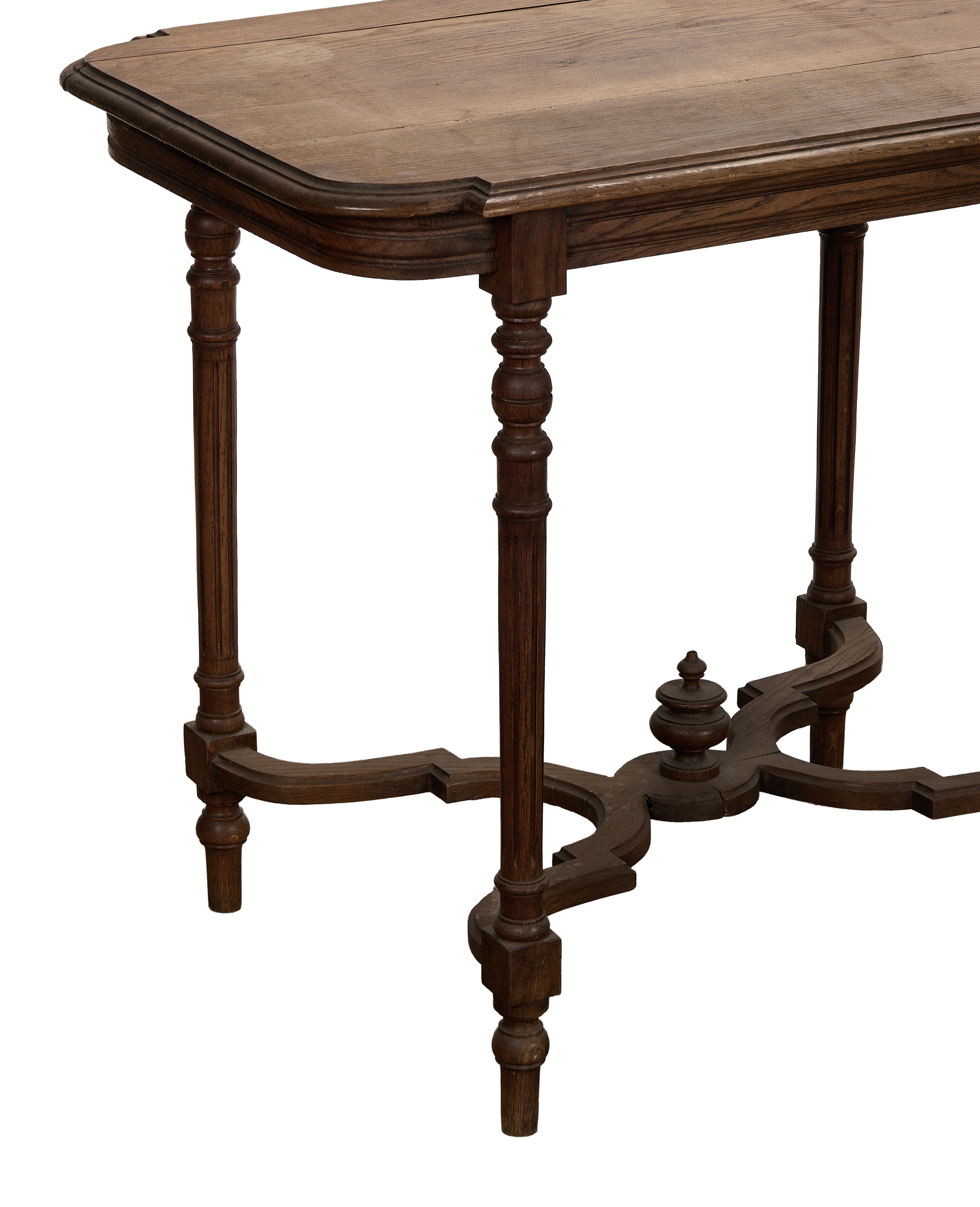Vintage Louis style oak table showcasing carved legs and intricate stretcher detail from French angle.