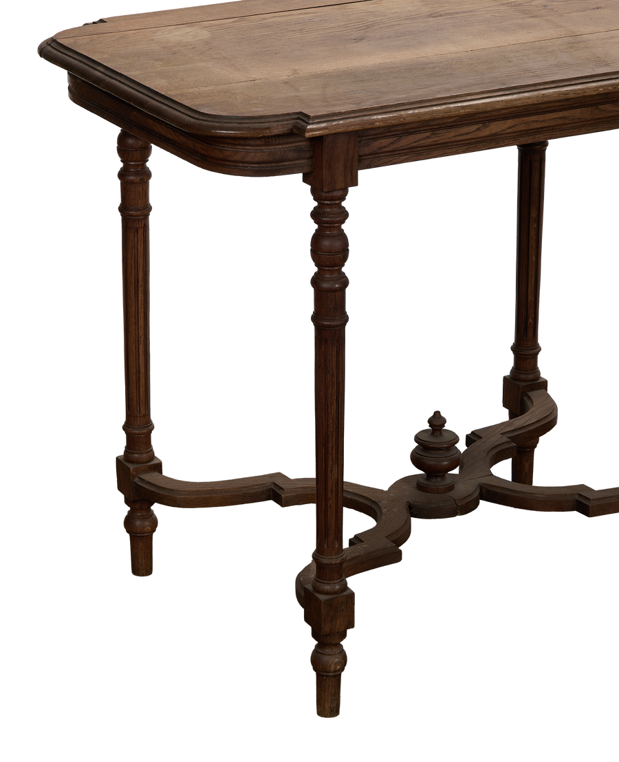 Vintage Louis style oak table showcasing carved legs and intricate stretcher detail from French angle.