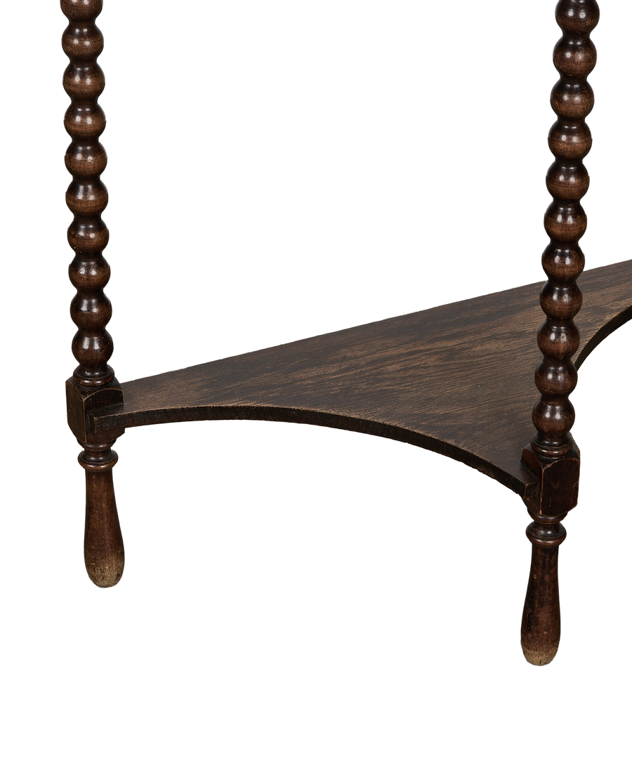 Vintage French demilune bobbin oak table with lower shelf detail and turned legs.