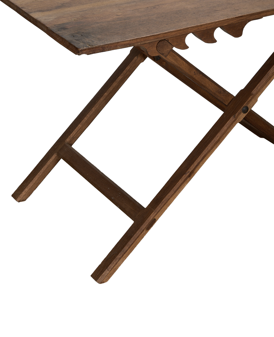 Vintage French adjustable wine table, showing hinged oak folding mechanism and ornate tabletop edge.