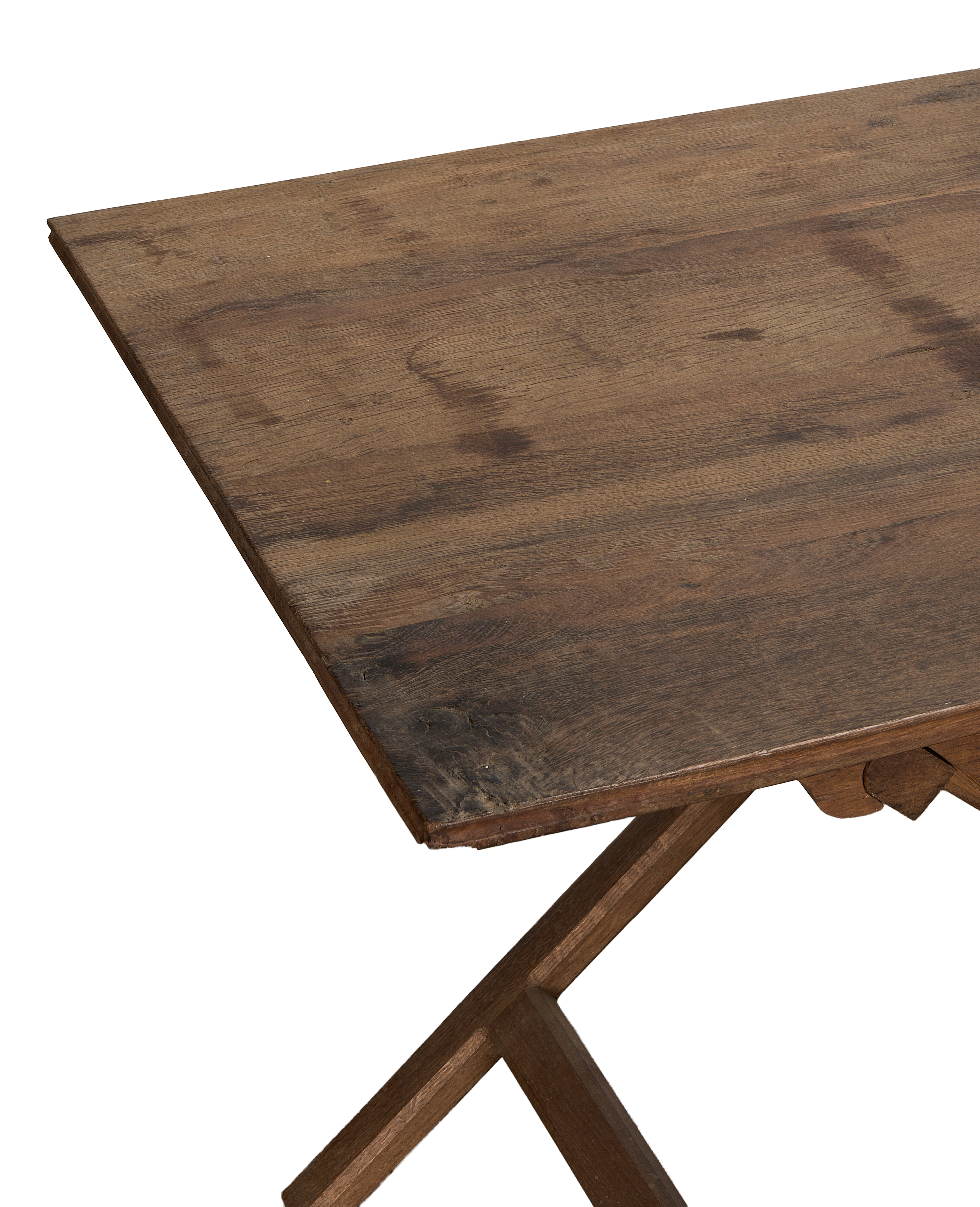 Vintage French oak wine table's weathered tabletop and rustic foldable base detail.
