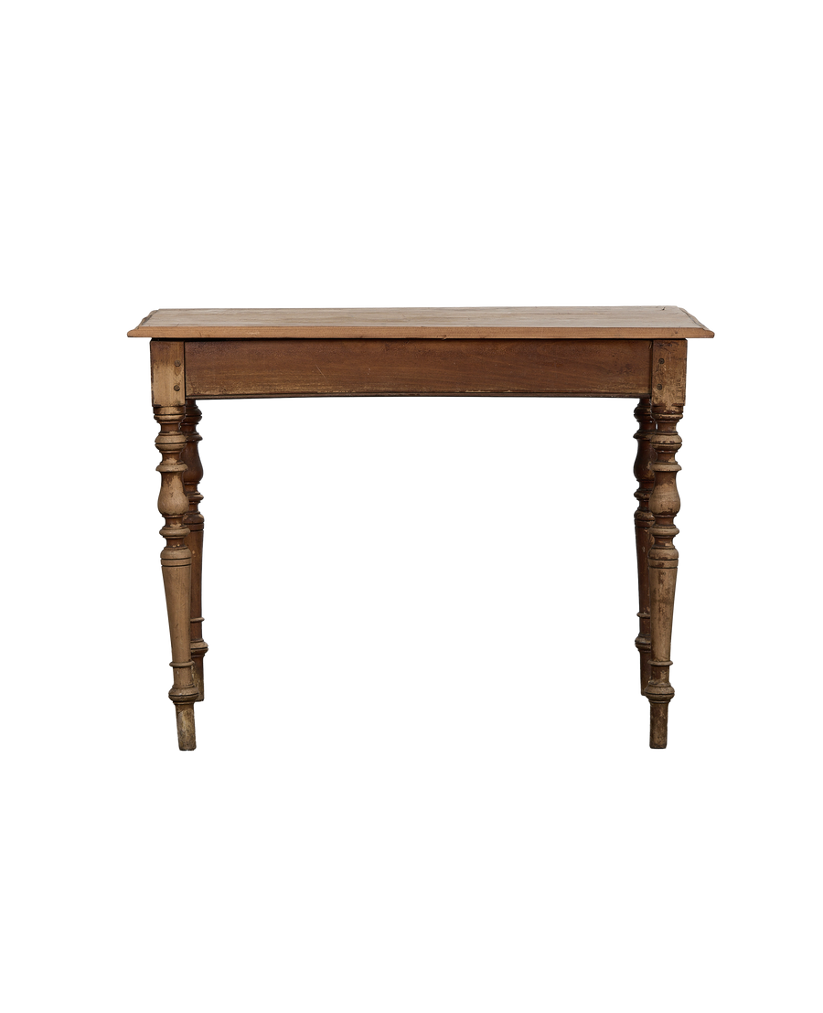 Side view: vintage French oak farm table, showing distressed finish and turned legs.