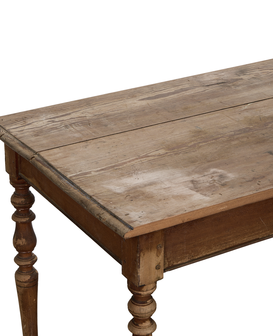 Vintage French oak farm table top showcasing natural patina and turned leg detail.