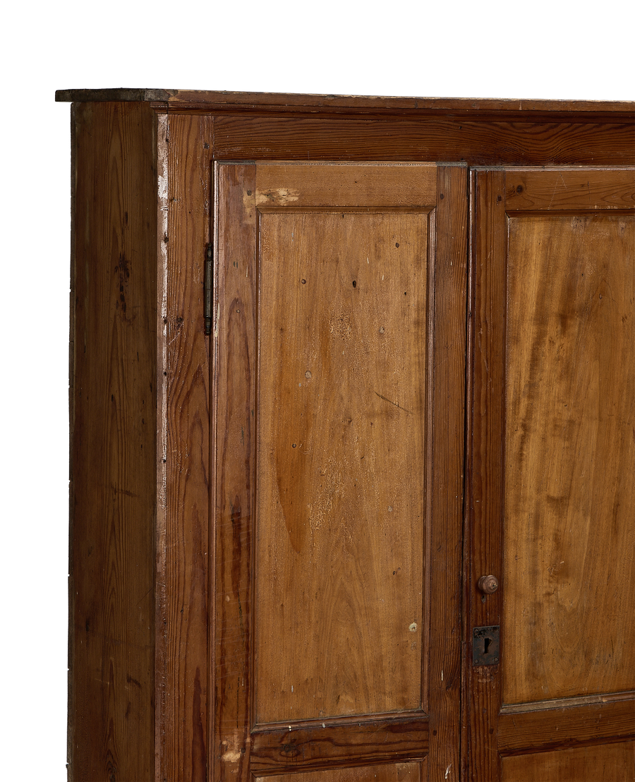 Vintage French oak changing room cabinet with paneled door and rustic hardware detail.
