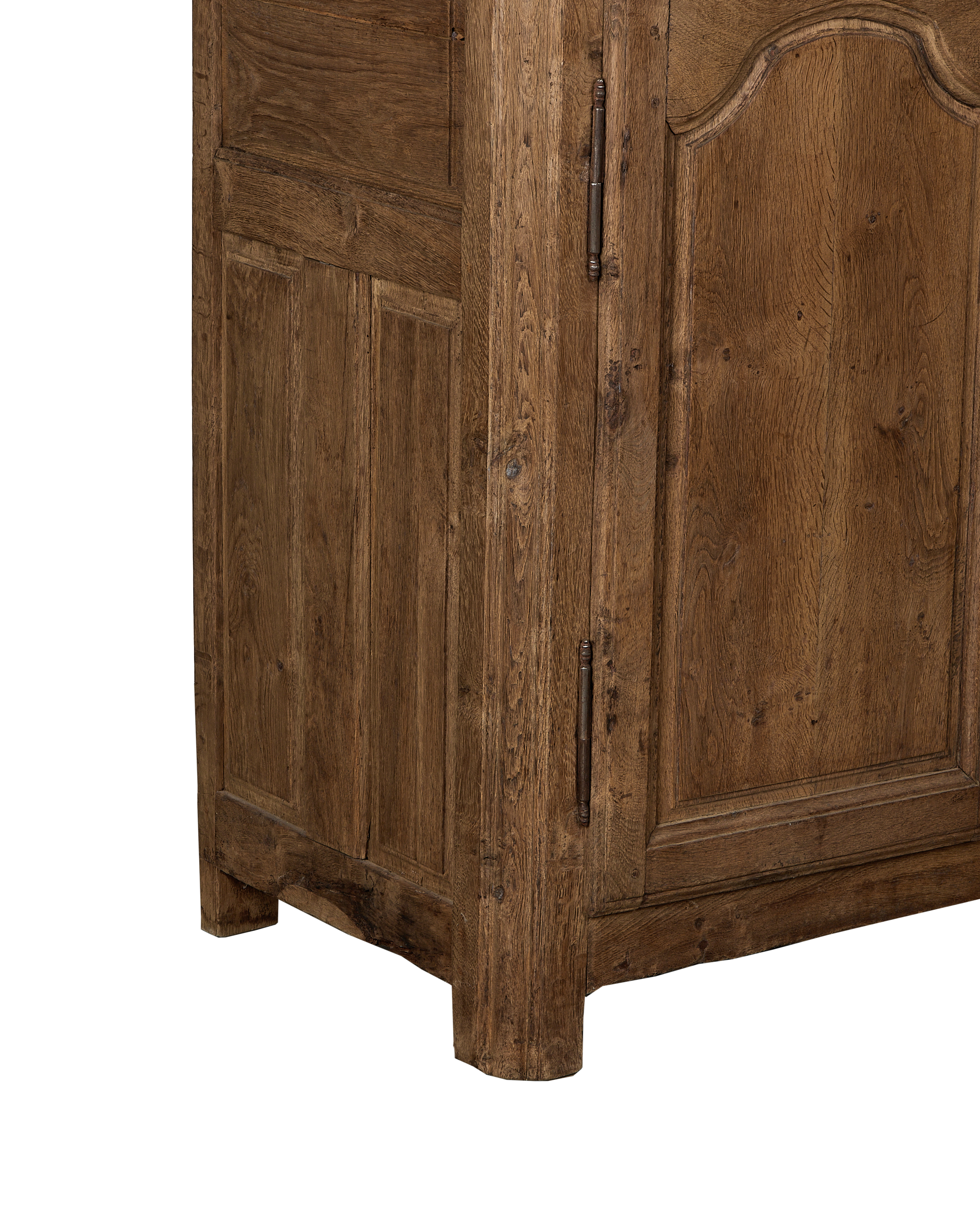 Vintage French oak sideboard, showing worn wood grain texture, curved door panel, and rusted hinge detail.