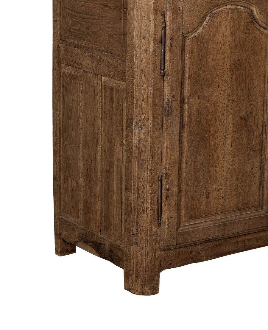 Vintage French oak sideboard, showing worn wood grain texture, curved door panel, and rusted hinge detail.