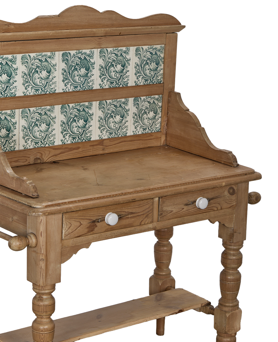 Vintage French oak cabinet, showing tiled backsplash detail, white ceramic knobs, and turned legs.