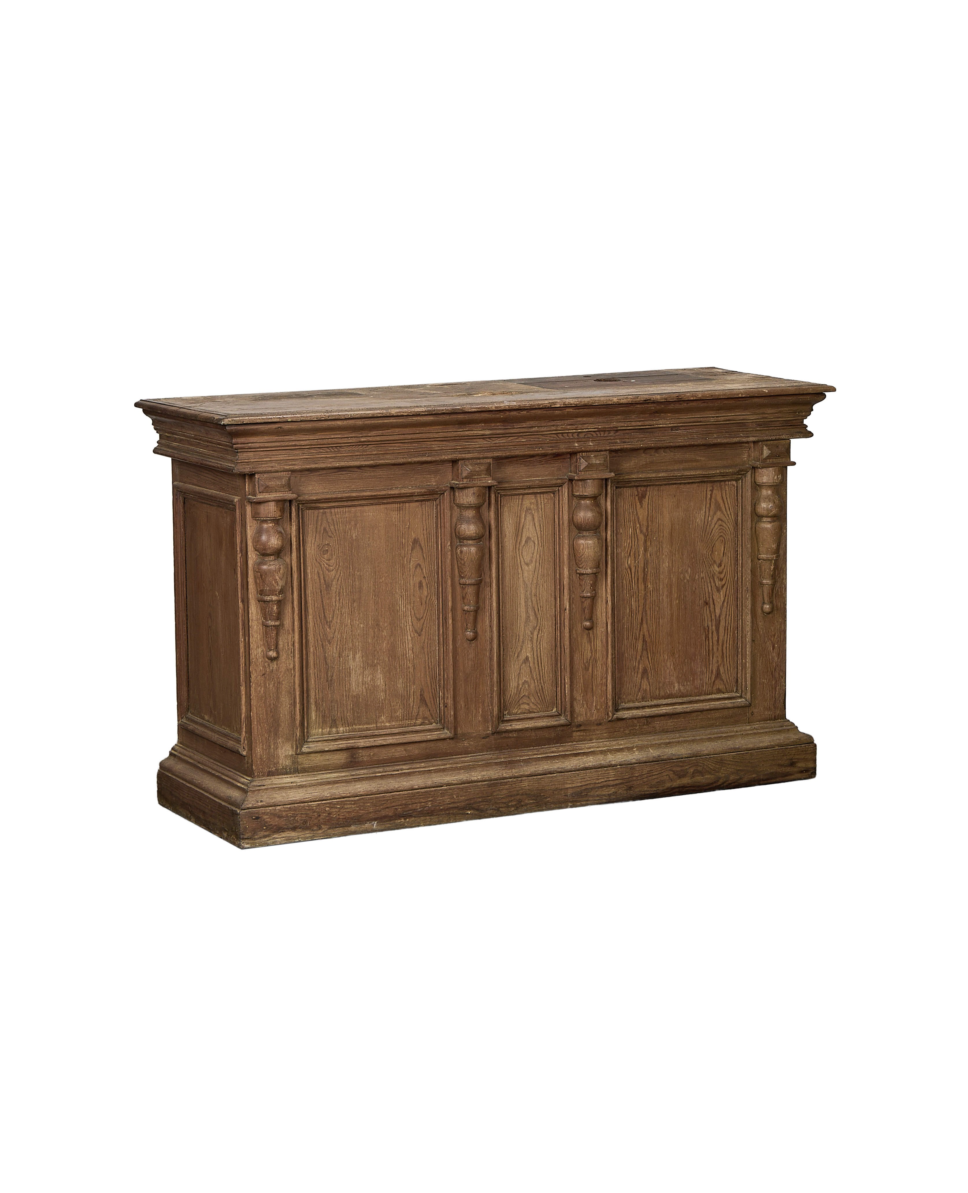 French vintage oak shop counter with detailed carved wooden pilasters and aged patina.