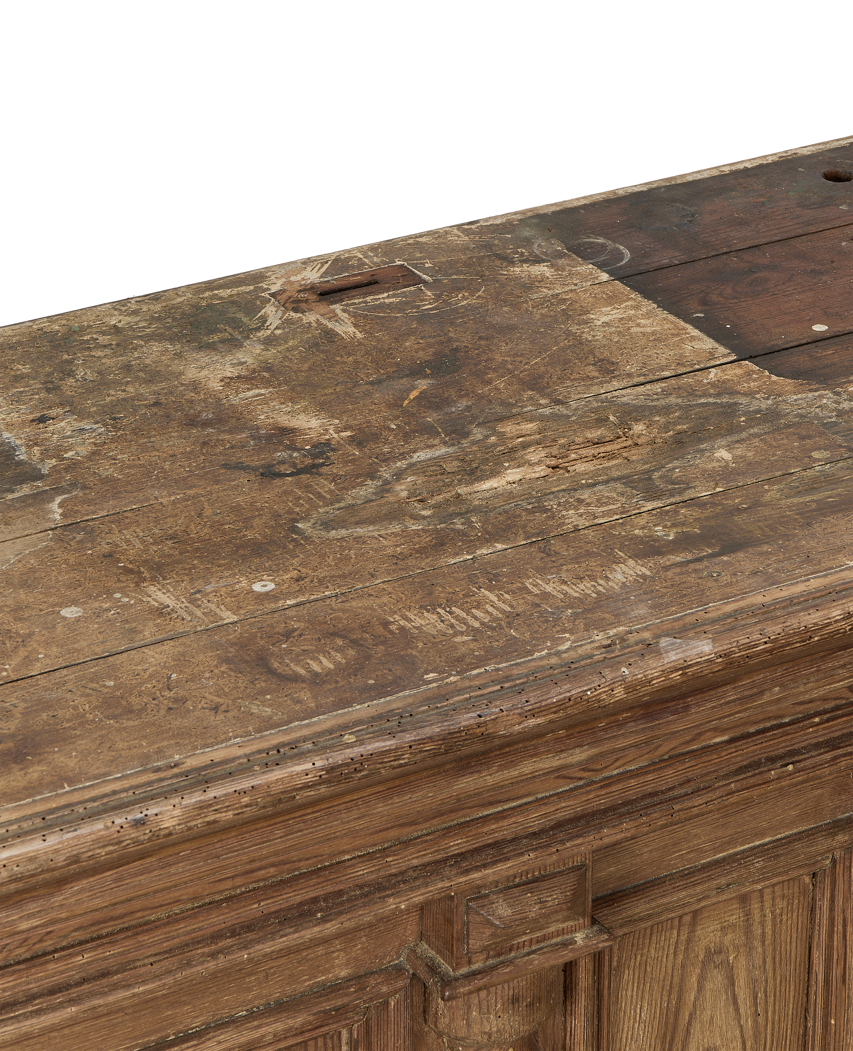 Distressed vintage oak shop counter top, showing wear, holes, and rich wood grain.