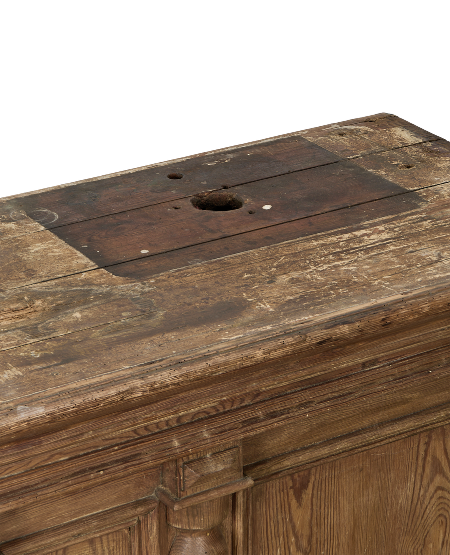 Vintage French oak shop counter's distressed, aged wood top with central hole.