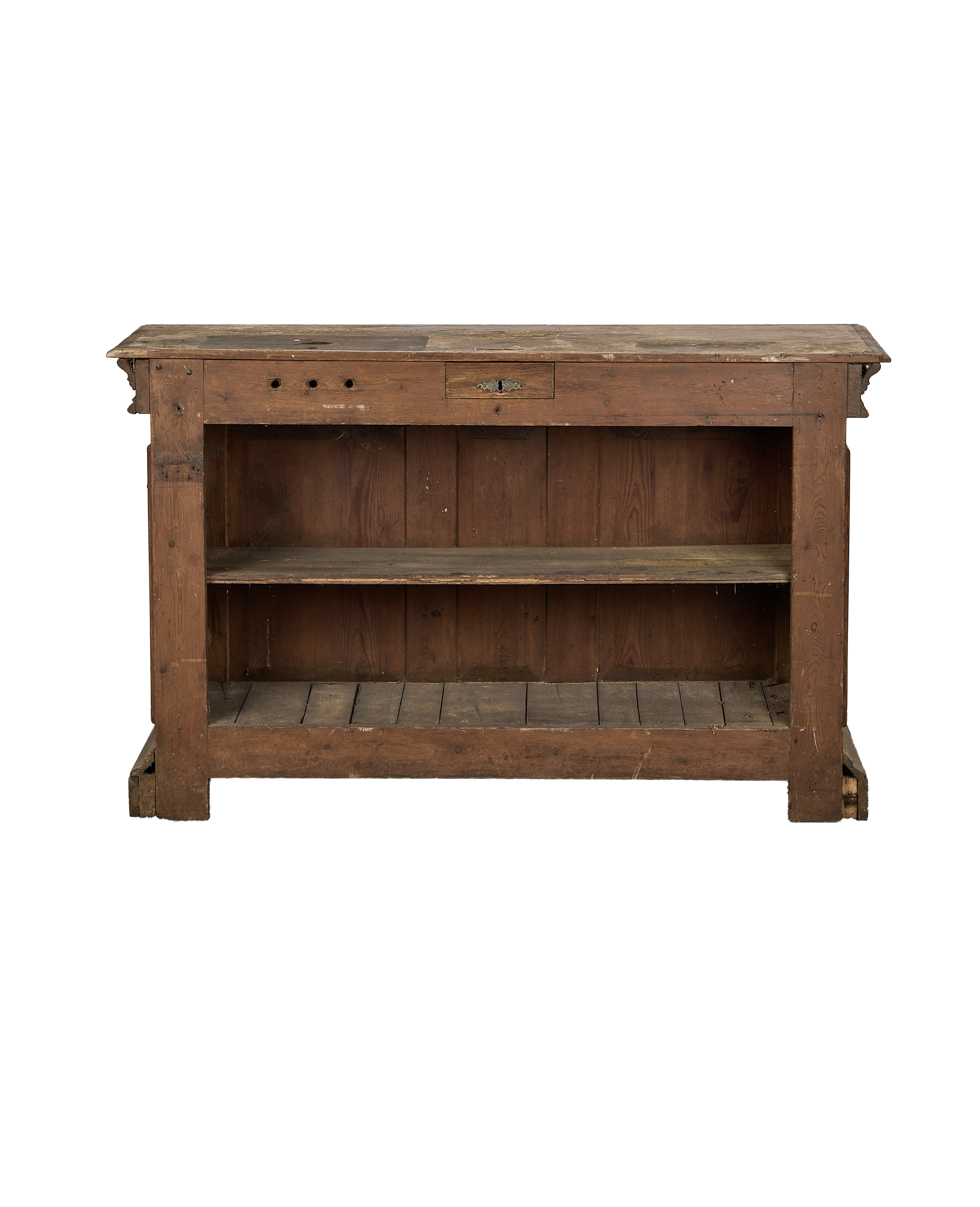 Vintage French oak shop counter from front, showing worn wood, drawer with keyhole.