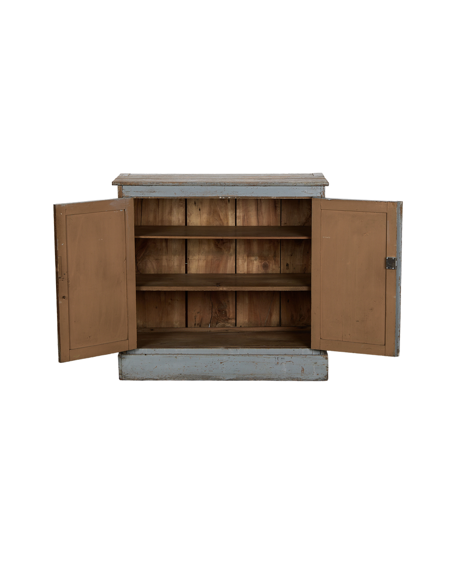 Vintage French oak cabinet with open doors reveals aged wood shelves, distressed light blue paint.