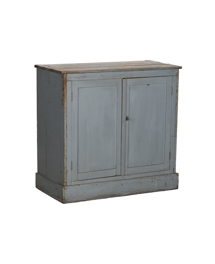 Vintage French oak cabinet, distressed faded light blue paint, showing worn top surface and base.