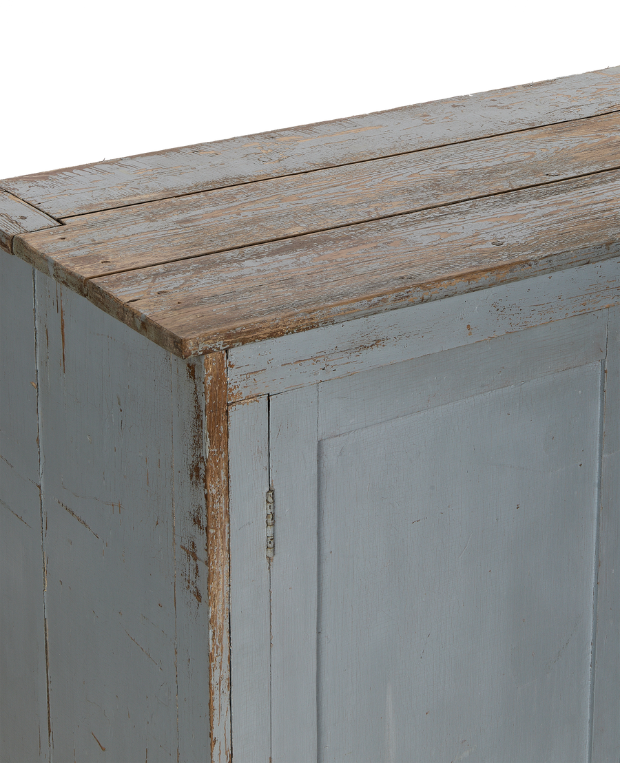 Vintage French oak wood cabinet, detailed view of distressed blue-gray painted finish and hinge.