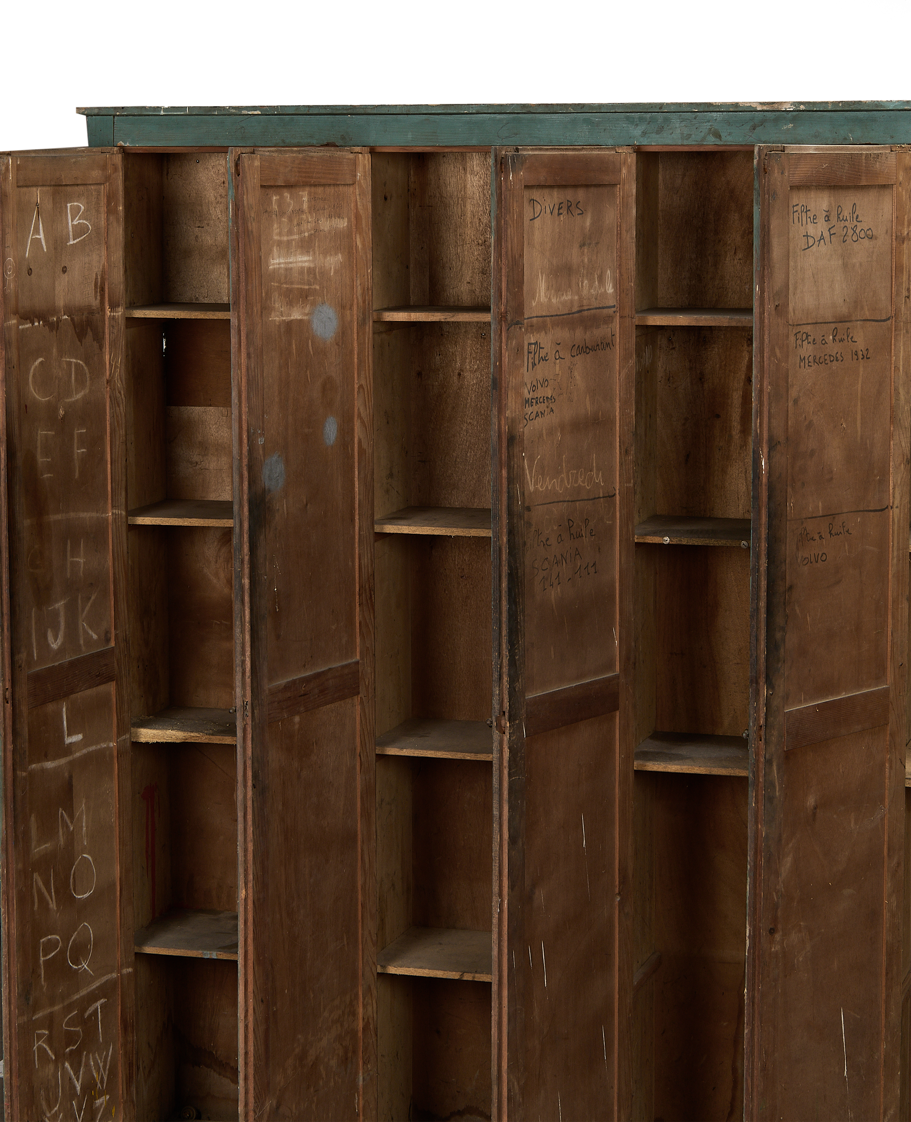French vintage oak locker cabinet, open doors revealing well-used shelves and interior markings.