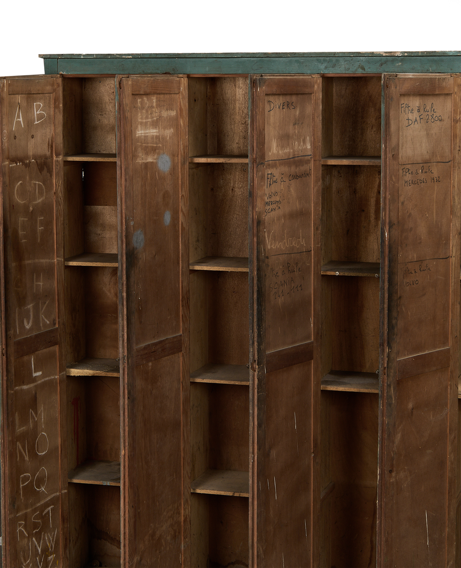 French vintage oak locker cabinet, open doors revealing well-used shelves and interior markings.