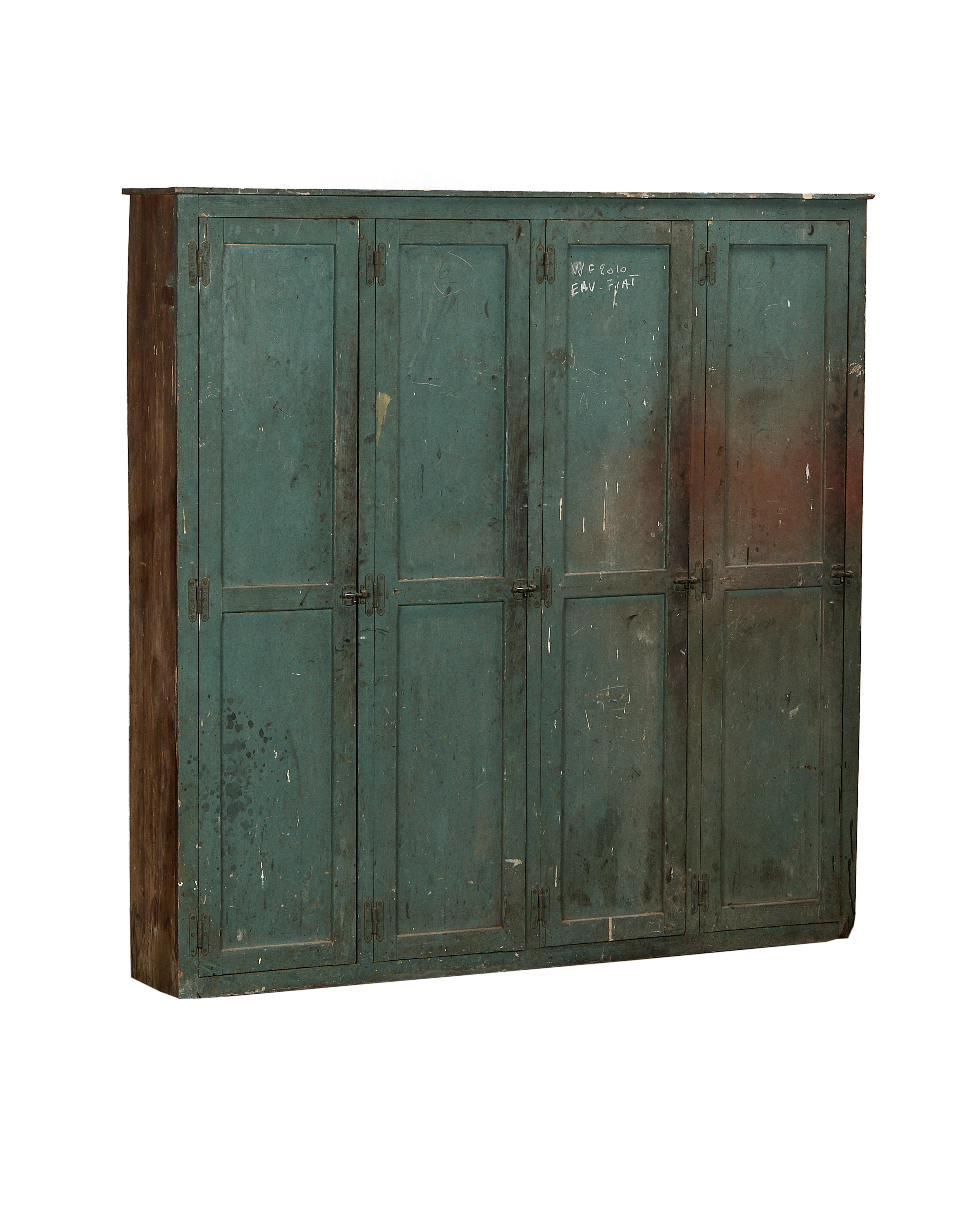 Vintage French oak wood locker cabinet with distressed green paint, showing its side profile.