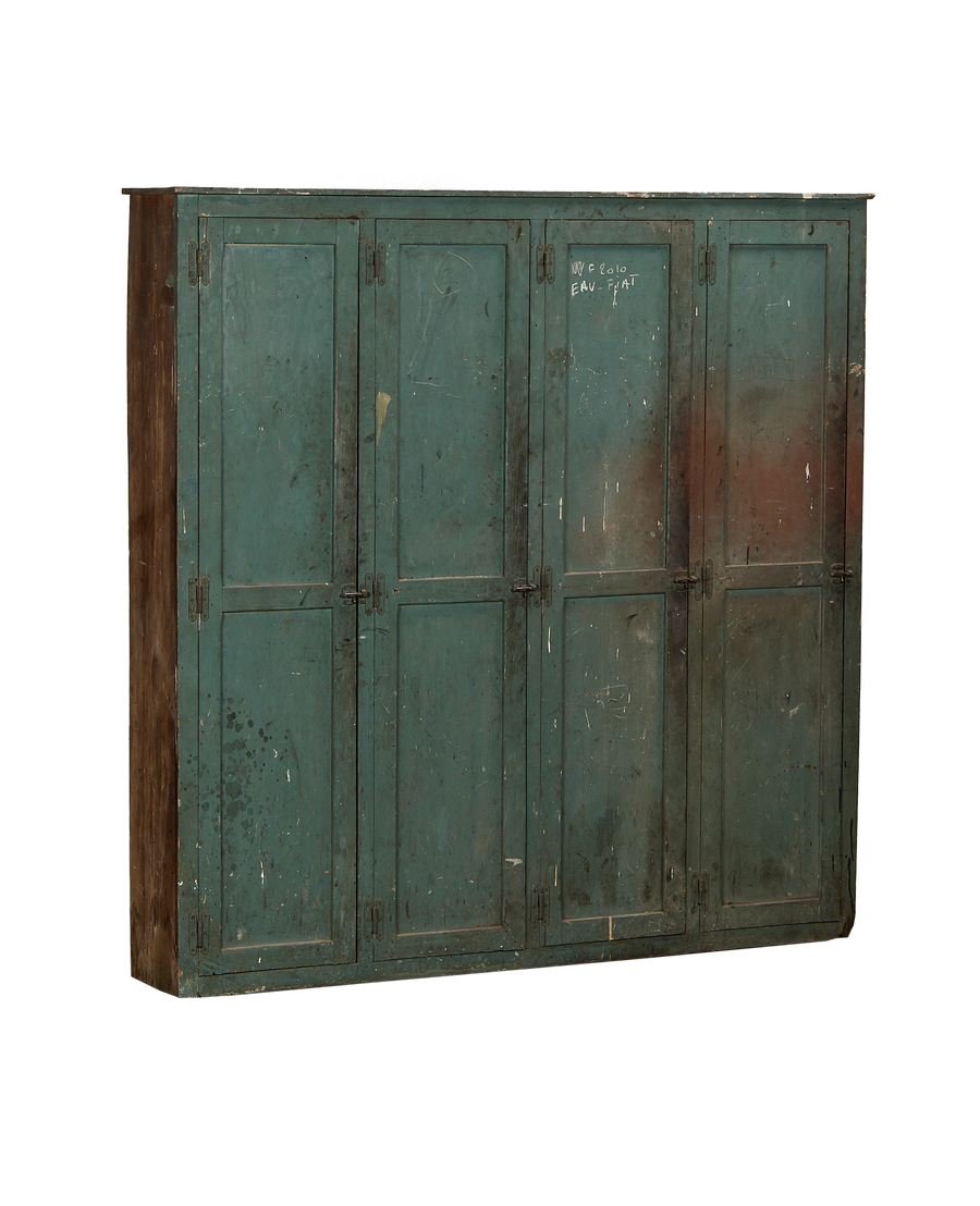 Vintage French oak wood locker cabinet with distressed green paint, showing its side profile.