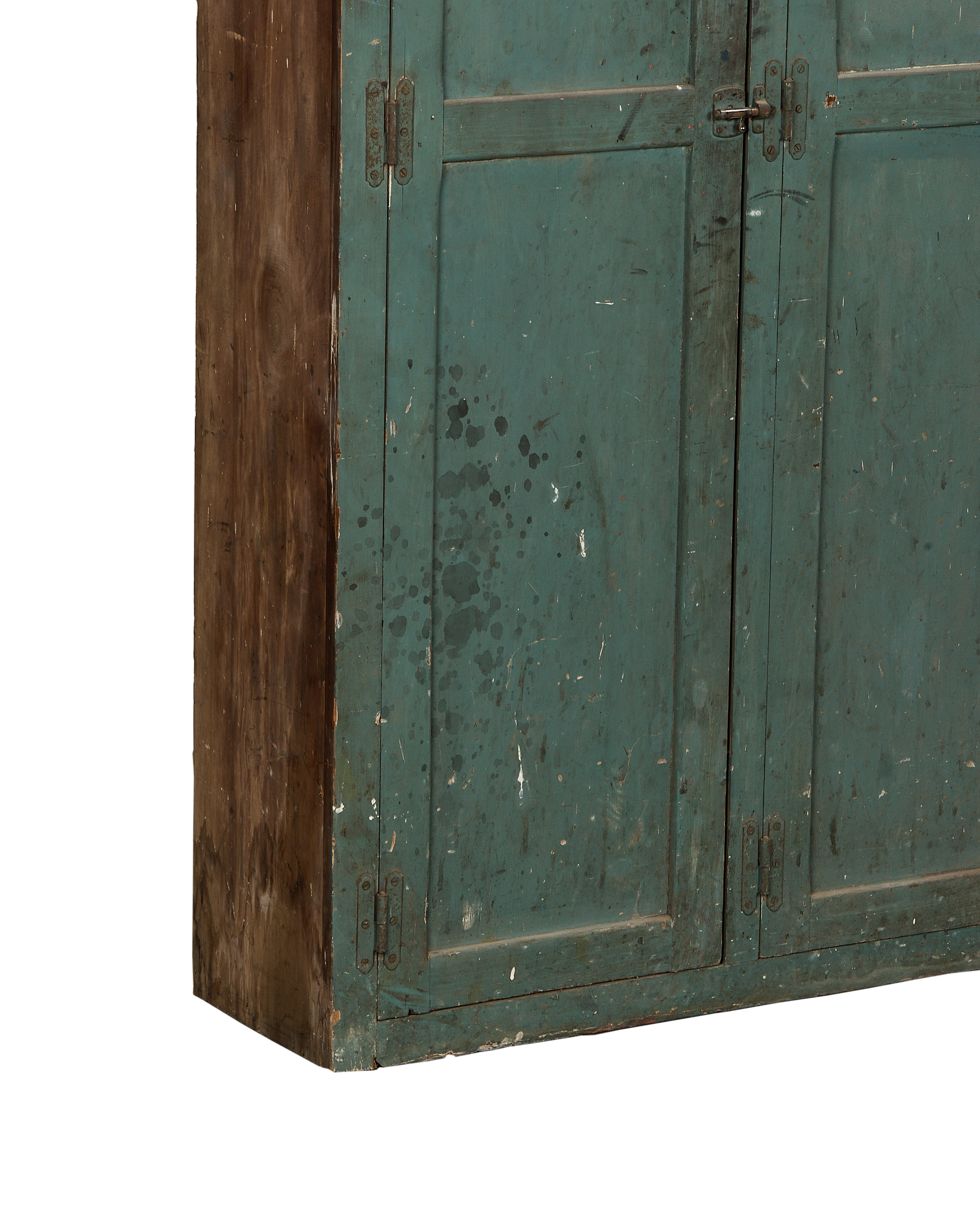 Close-up of vintage French oak locker's chipped teal paint and distressed wood side.