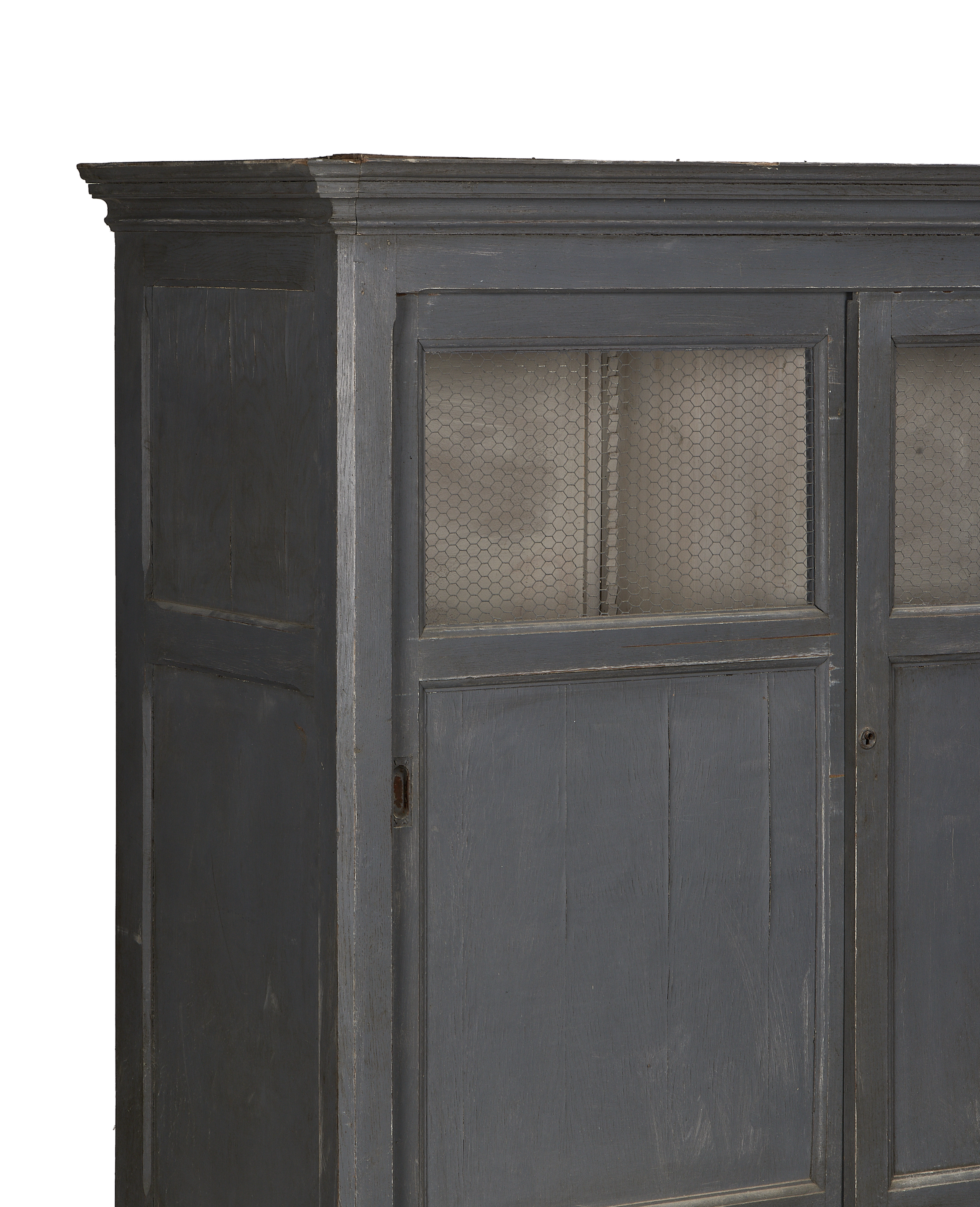 French vintage oak cabinet, painted gray, showing upper doors with chicken wire and distressed finish.