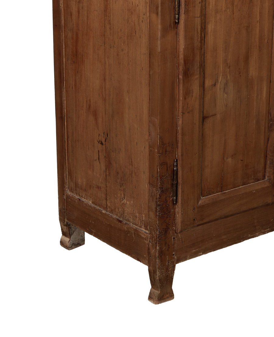 Vintage oak Parisian cabinet, showing distressed bottom trim and original metal hinges.