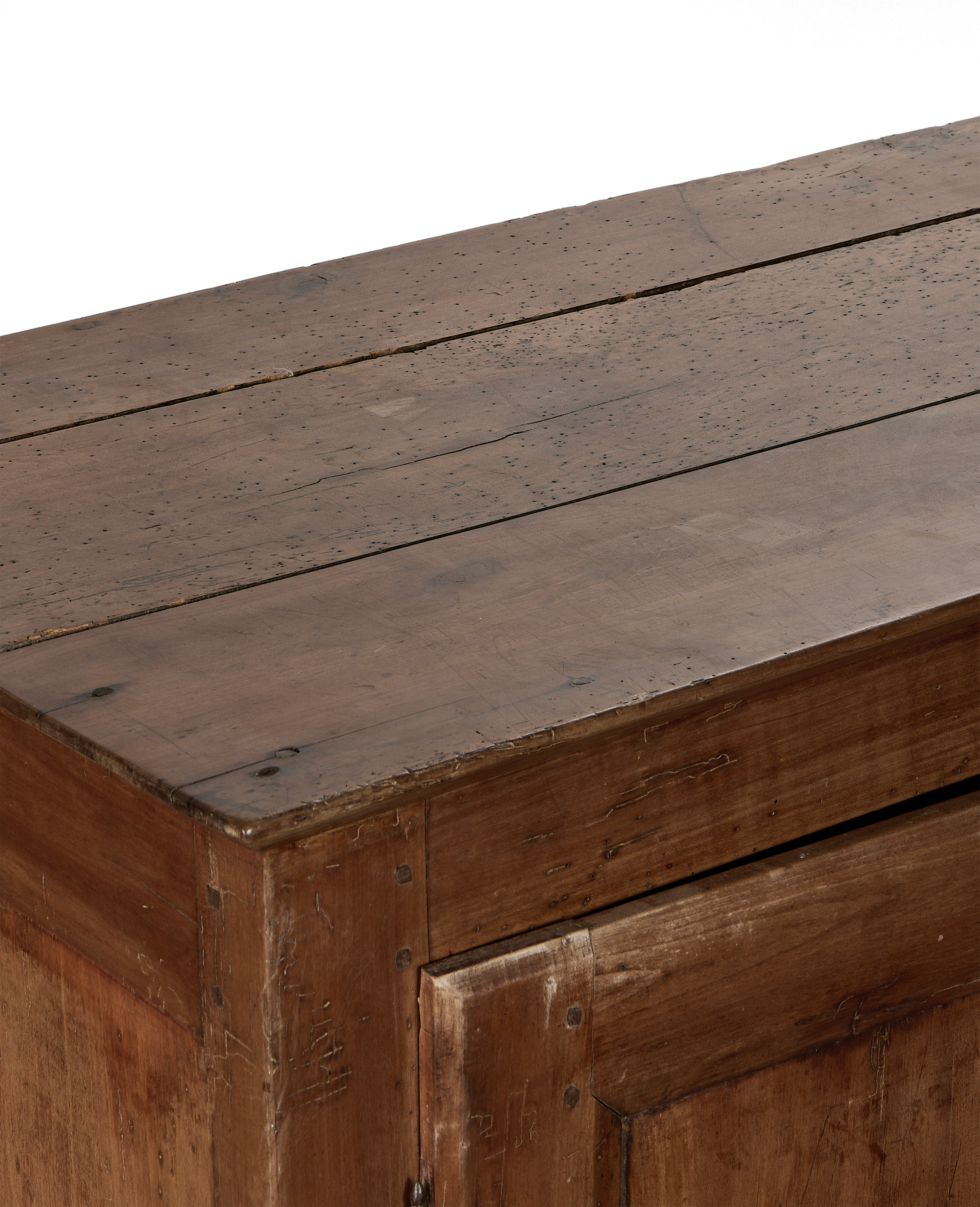 Distressed oak cabinet top and side, showing vintage wood grain, nail holes, and wear.