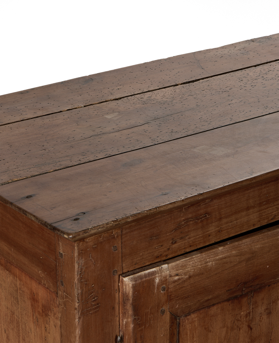 Distressed oak cabinet top and side, showing vintage wood grain, nail holes, and wear.