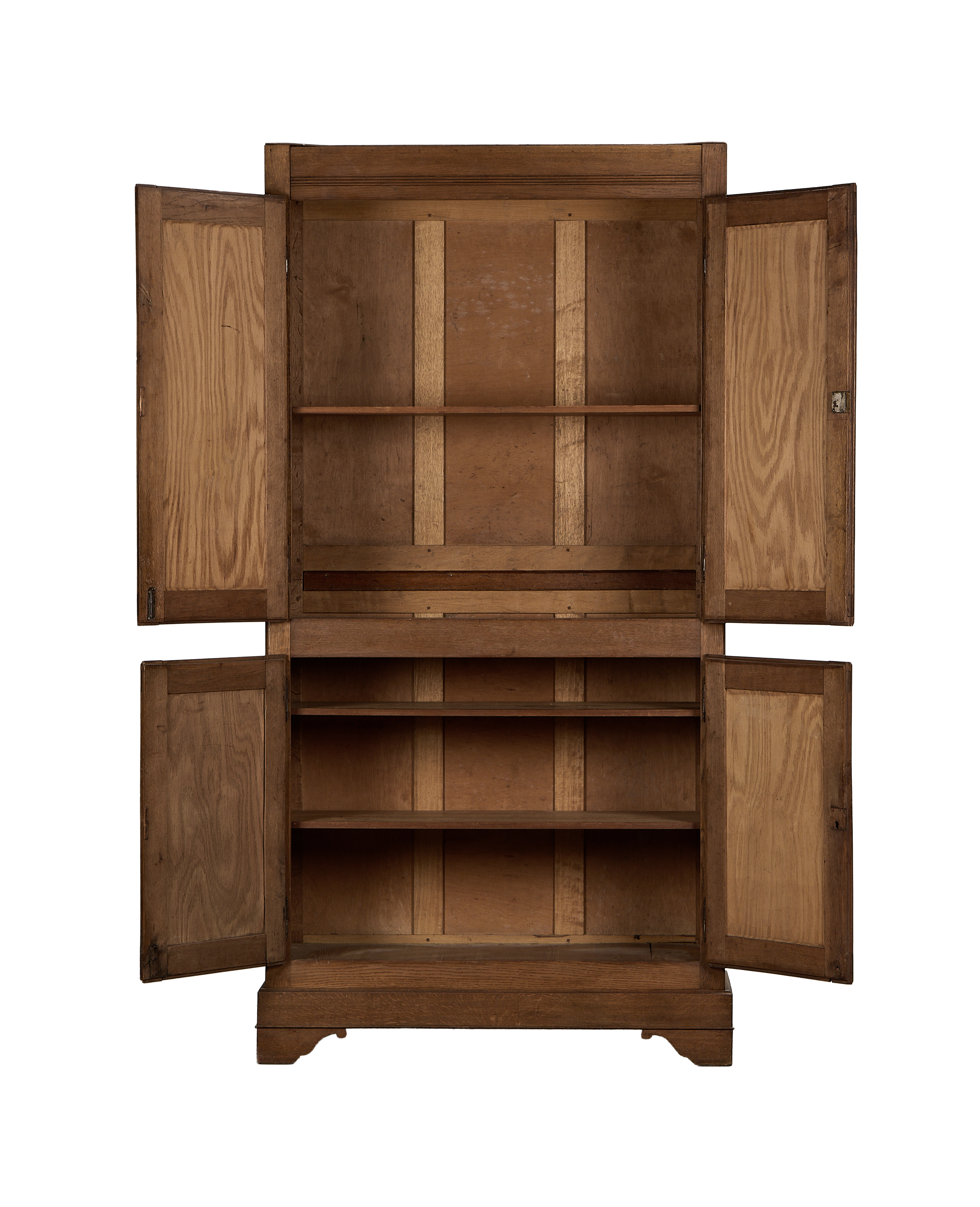 Vintage French oak armoire, interior shelves and open doors revealing aged wood grain.