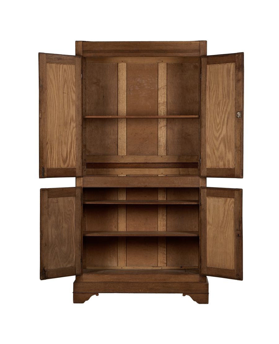 Vintage French oak armoire, interior shelves and open doors revealing aged wood grain.