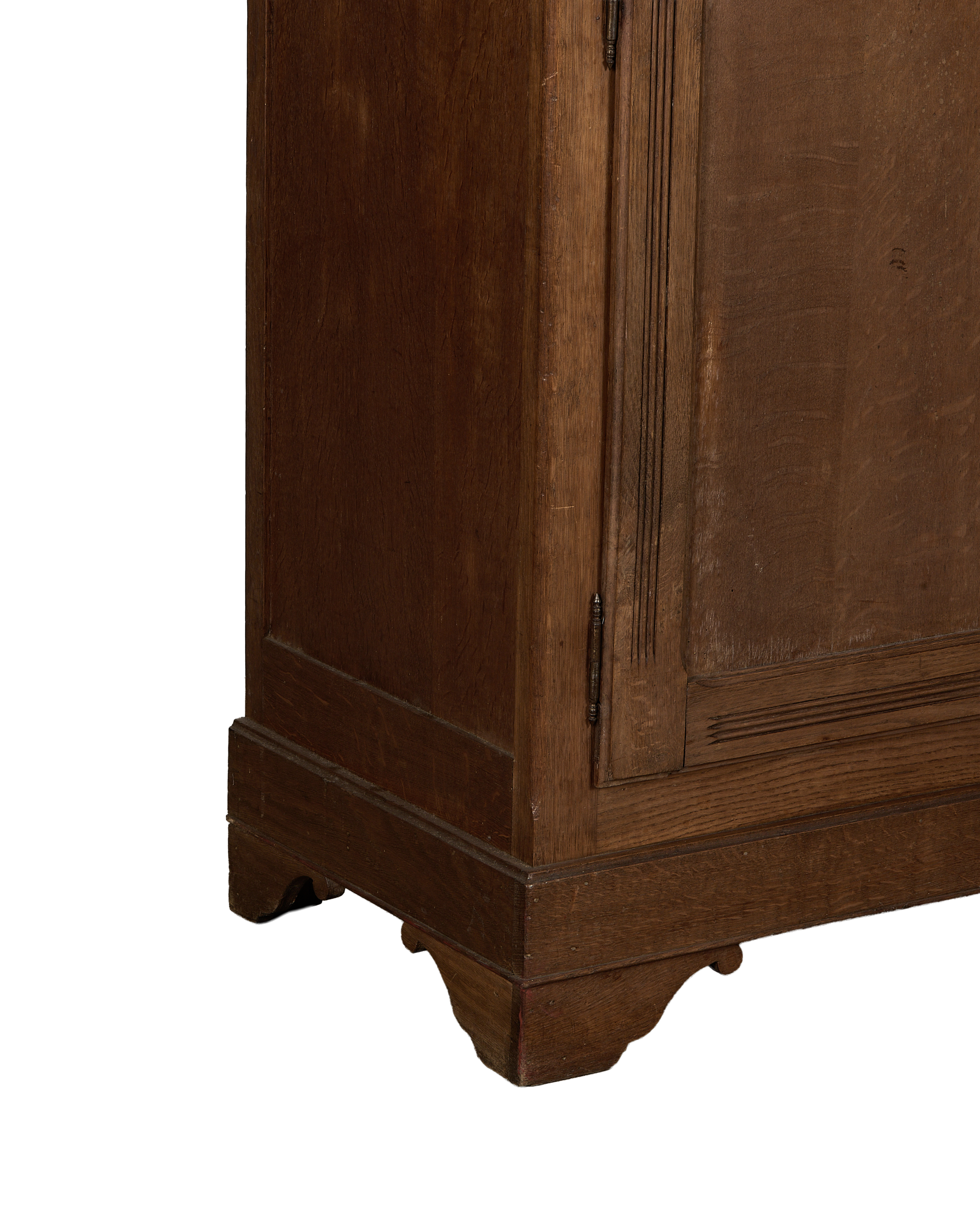 Vintage French Oak wood armoire, detailed base with carved scrolled feet and dark finish.