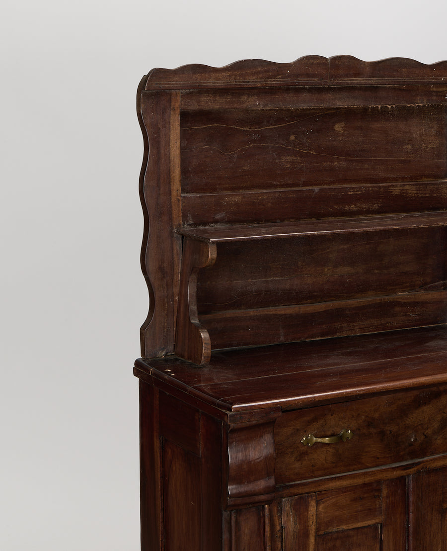 Vintage French oak hutch, close-up of decorative curved wood details and top shelf.