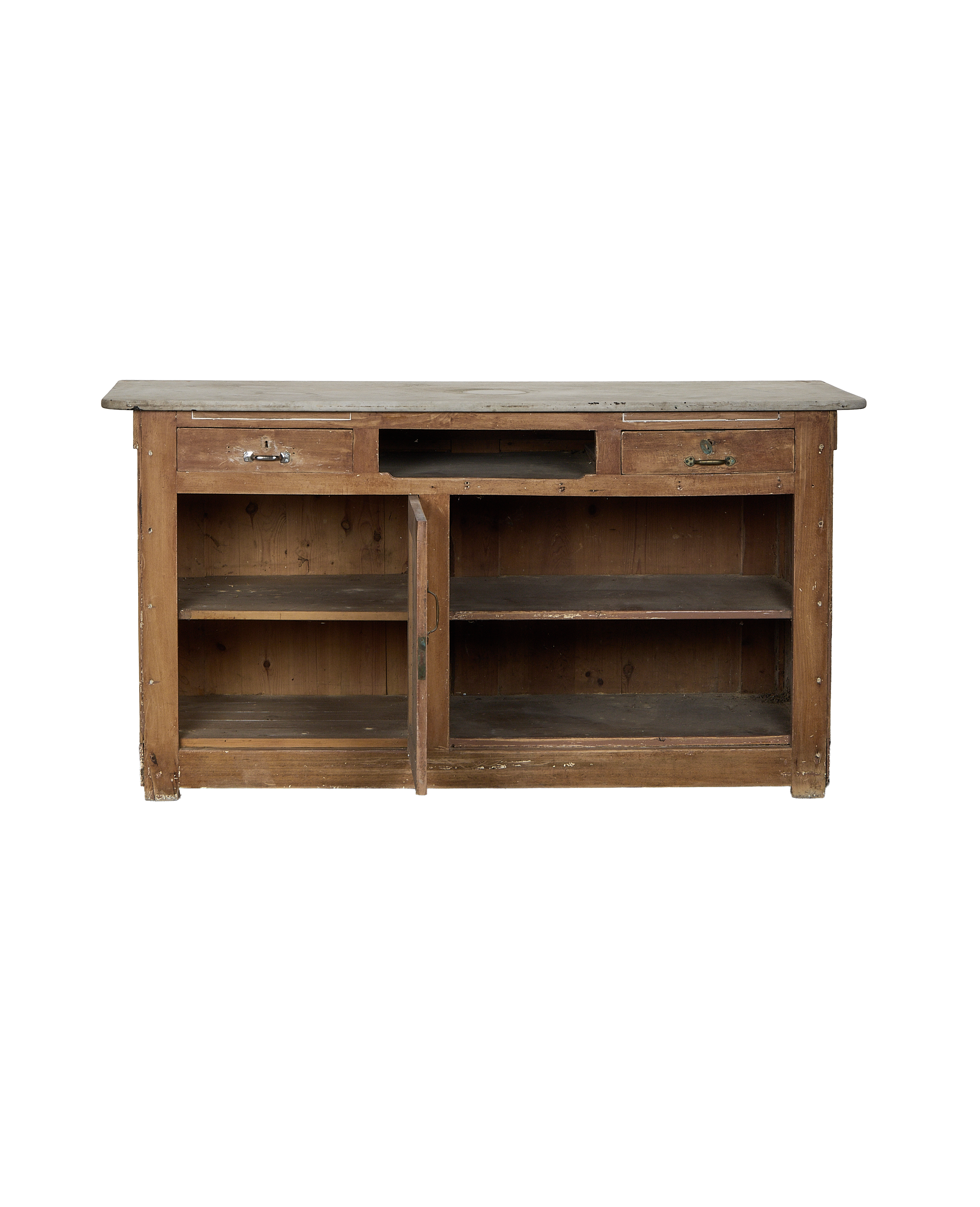 Vintage French oak bakery counter with open cabinet doors revealing interior shelves.